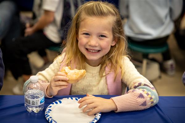 girl eating a donut